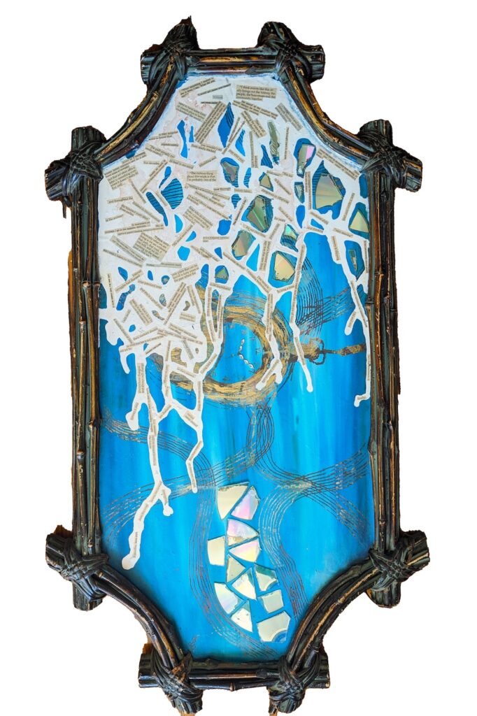 A framed artwork. It is abstract, mostly blue and incorporates maps. 